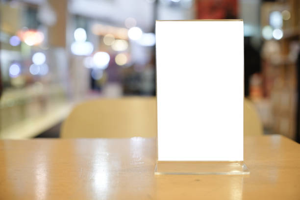 istock Menu frame space for text marketing promotion standing on wood table in Bar restaurant cafe. 1140510639