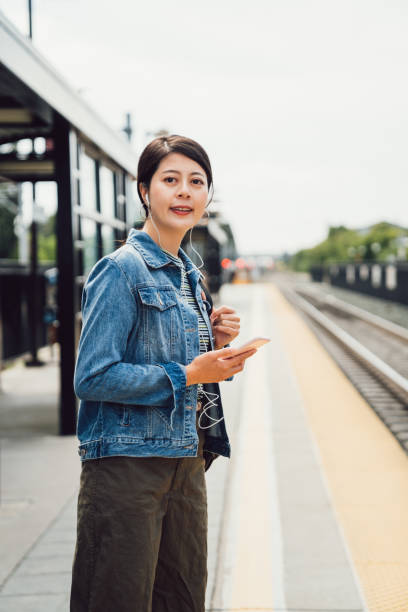 istock lady with headphones enjoy music while commute 1140513466