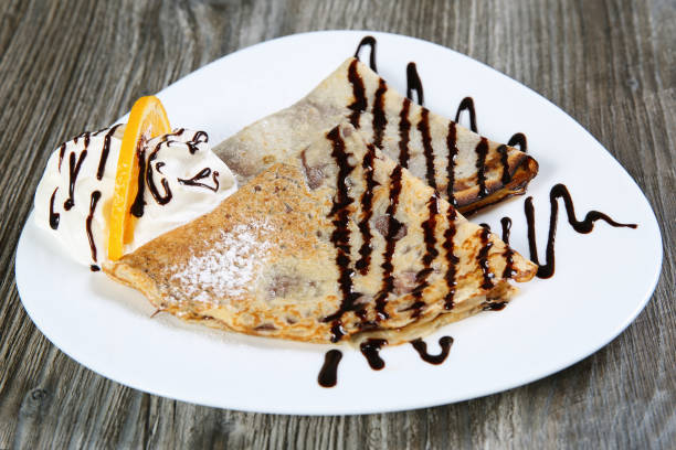istock French pancakes with chocolate, ice cream and orange 1140513489