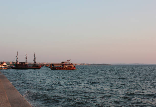 Thessaloniki, Greece â july 25, 2019: Tourist pirate style boat sailing near the Thessaloniki promenade with passengers enjoying a summer cruise.