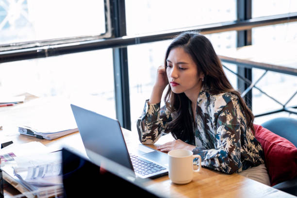 Asian Business Women Stressed About Her Work