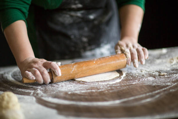 istock Dough with rolling pin on wooden table 1140516287