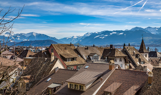 A view of the Swiss Alps as seen over the outskirts of Bern. In the center of the peaks are the Eiger, the Munch and the Jungfrau mountains.