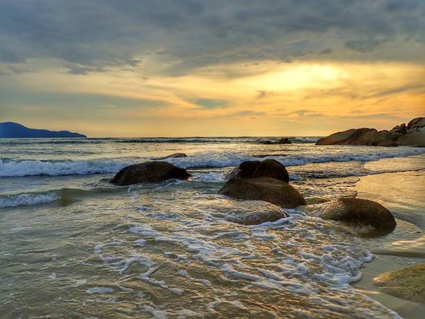 istock Beautiful sunset view on sea shore with stony background. 1140519699
