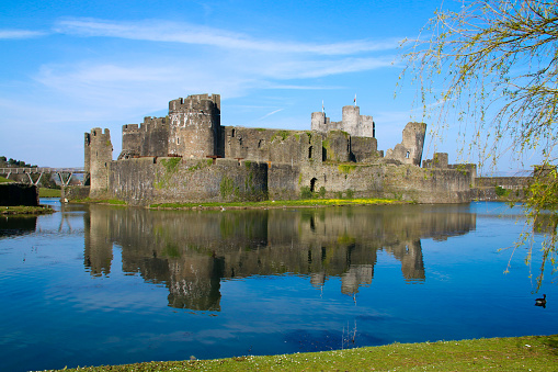 Caerphilly Castle, South Wales, UK March 30, 2019: Caerphilly Castle near Cardiff. The castle is a major feature to Caerphilly town center and a popular area for visitors and tourists visiting wales.