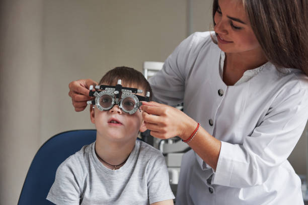 istock Working in process. Child sitting in the doctor's cabinet and have tested his visual acuity 1140521088