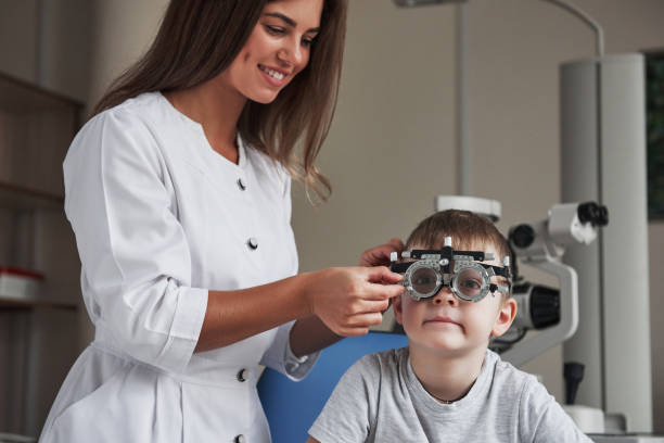 istock Child sitting in the doctor's cabinet and have tested his visual acuity 1140521101