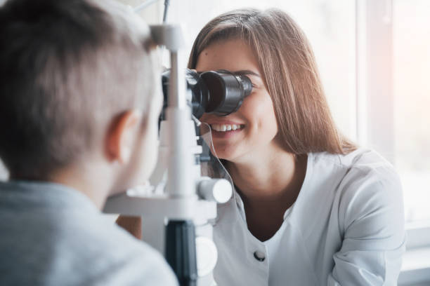 istock White light coming from the window. Little boy having test for his eyes with special optical apparatus by female doctor 1140522142