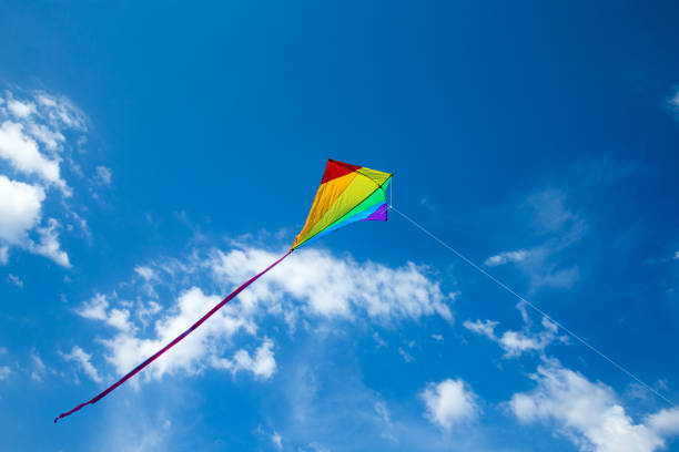 istock Kite flying in the sky among the clouds 1140523703