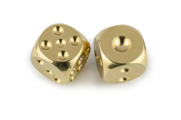 istock Two golden dices closeup isolated on white background. Five and one, with a shadow. 1140523822