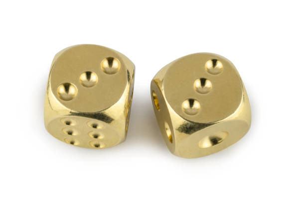 istock Two golden dices closeup isolated on white background. Three and three, with a shadow. 1140523834