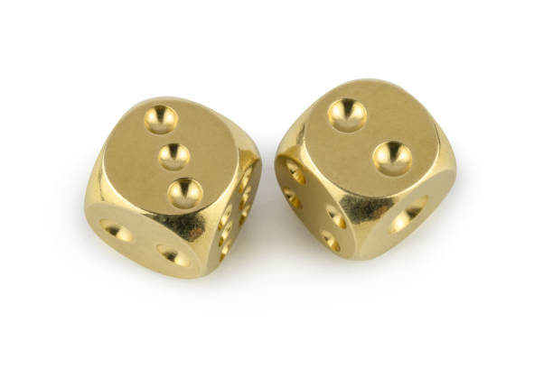 istock Two golden dices closeup isolated on white background. Three and two, with a shadow. 1140523872