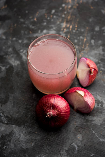 istock Medicinal Onion juice/syrup in a glass with raw onions. selective focus 1140523890