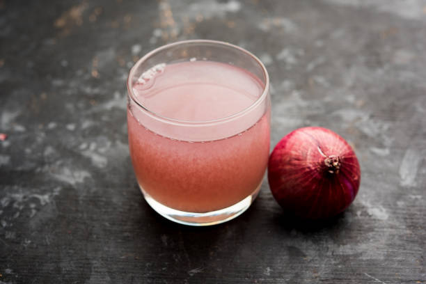 istock Medicinal Onion juice/syrup in a glass with raw onions. selective focus 1140524549
