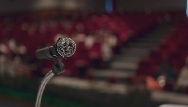 istock Microphone on the table in seminar or conference hall 1140524753