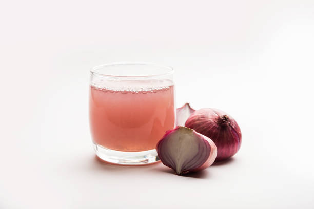 istock Medicinal Onion juice/syrup in a glass with raw onions. selective focus 1140524842