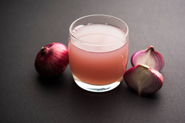 istock Medicinal Onion juice/syrup in a glass with raw onions. selective focus 1140524928