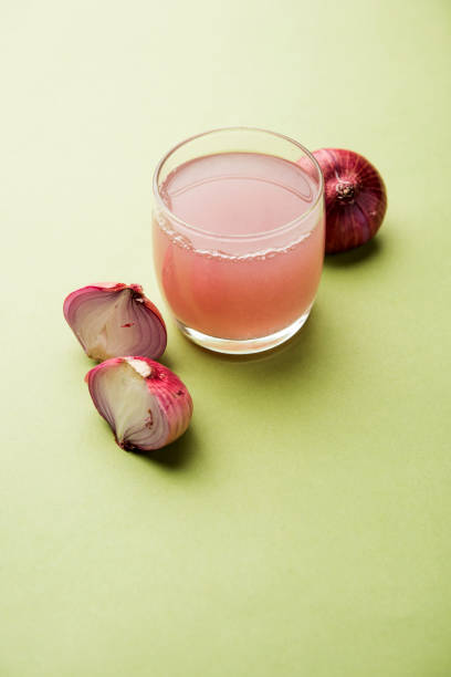 istock Medicinal Onion juice/syrup in a glass with raw onions. selective focus 1140525047