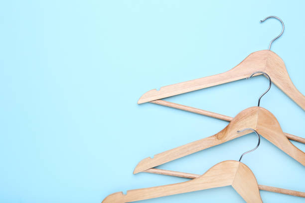 istock Wooden hangers on blue background 1140525104