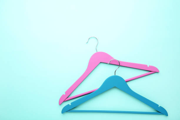 istock Colorful hangers on blue background 1140525137