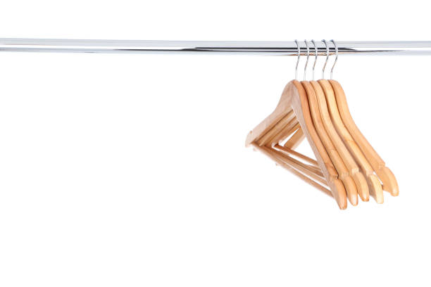 istock Wooden hangers hanging on white background 1140525145