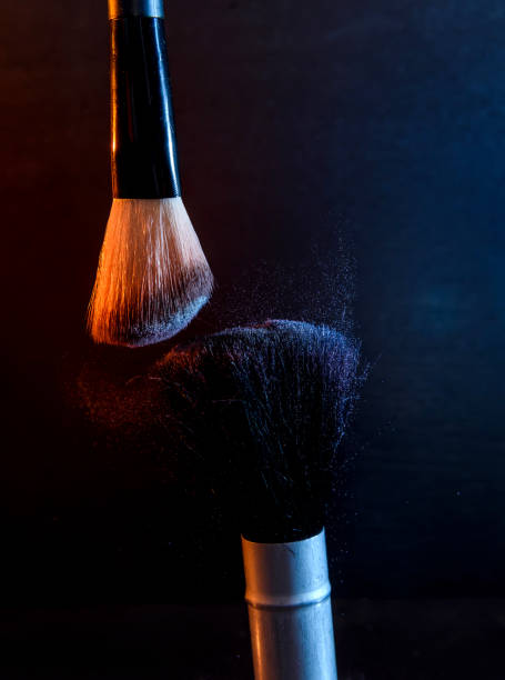 istock Brushes for makeup with powder on dark background 1140525163