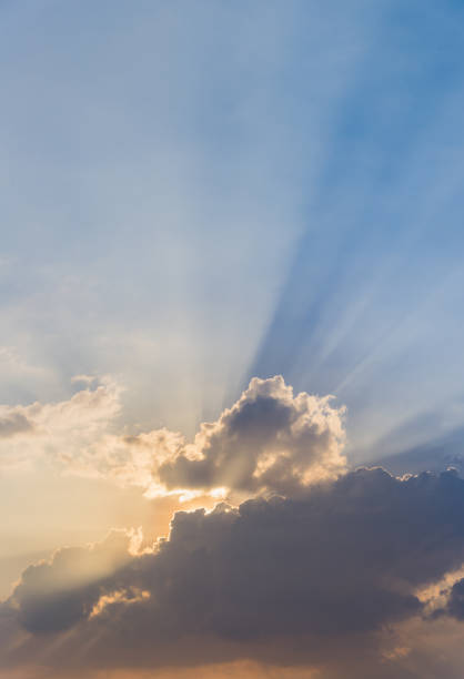 istock Beautiful dramatic sky clouds with light rays at sunset. Natural landscape for background 1140525218