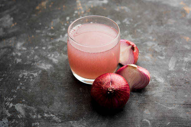 istock Medicinal Onion juice/syrup in a glass with raw onions. selective focus 1140525295
