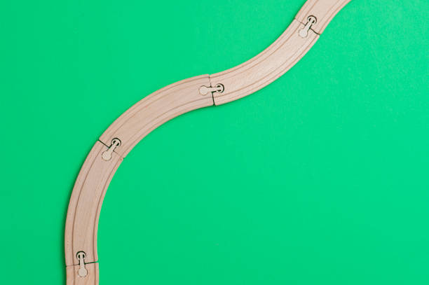 istock wooden rails on green background. Top view. 1140525359