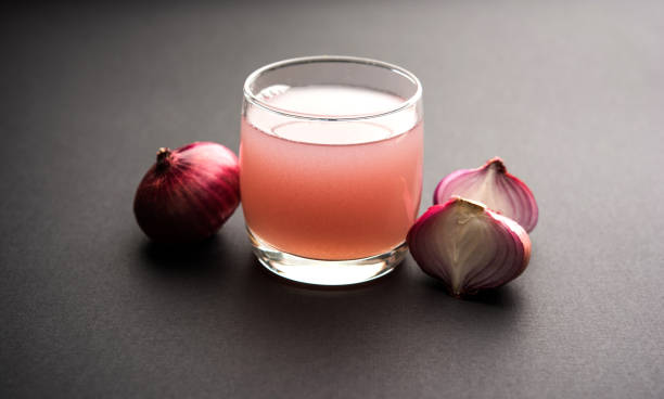 istock Medicinal Onion juice/syrup in a glass with raw onions. selective focus 1140526065
