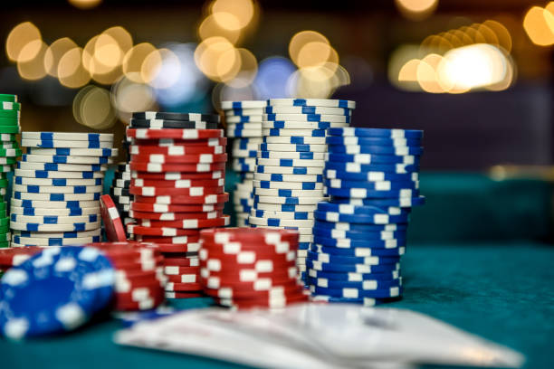 istock Playing cards with colorful poker chips close up 1140526246