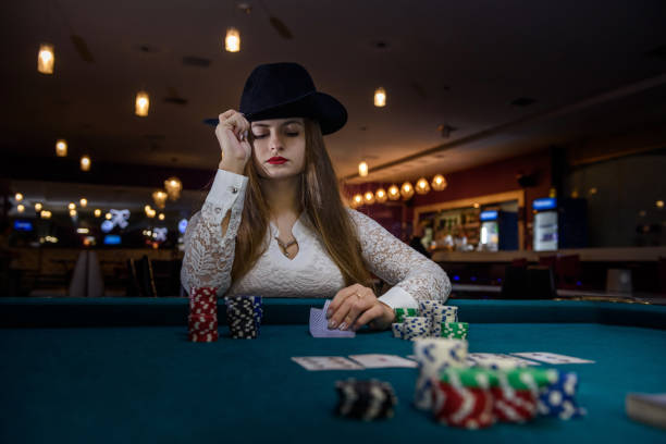 istock Woman in hat offering casino chips on palm 1140526362
