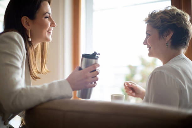 istock Female colleagues talking in confidence and smiling 1140527381