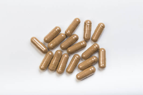 istock set of herbal  capsules on a white background - Image 1140527469