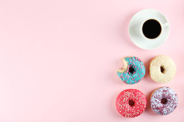 istock Minimal composition in vibrant colors with bright glaze donuts. 1140528529