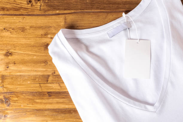 istock White t-shirt on a wooden background - Image 1140528902