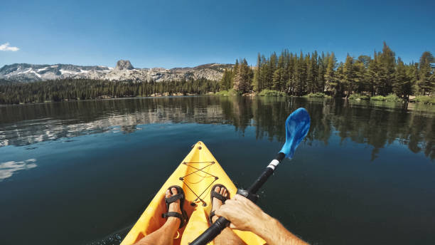 POV kayaking in lake recreational area