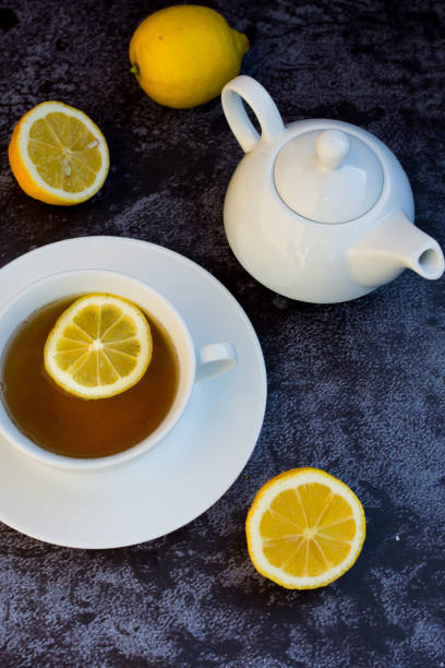 istock A cup of tea and lemon on a dark background. Top view 1140530606