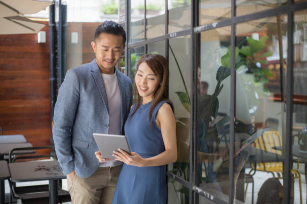 istock Young Asian Business People Using Tablet Together 1140531241