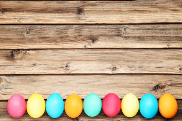 istock Colorful easter eggs on brown wooden table 1140531678