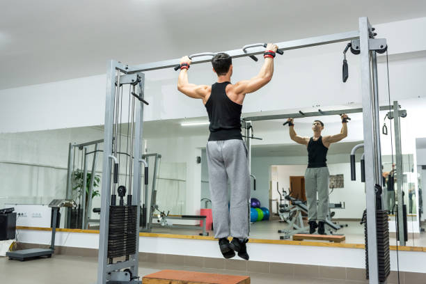 istock Young and athletic man doing exercises on crossbar 1140532274