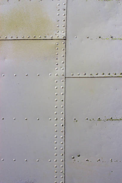 istock gray metal wall texture with seams and rivets 1140533741