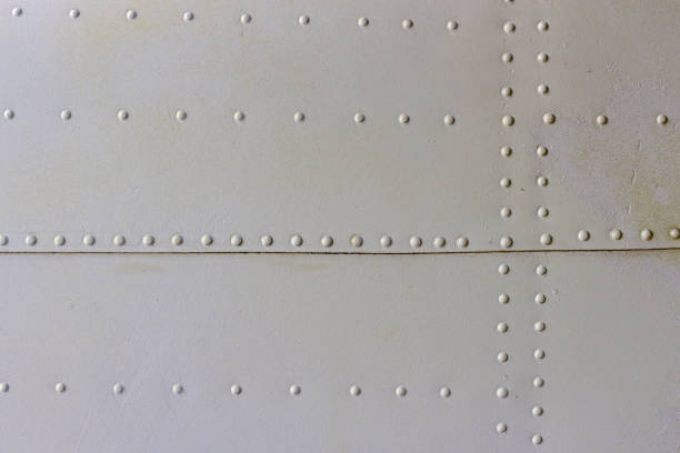 istock gray metal wall texture with seams and rivets 1140533744