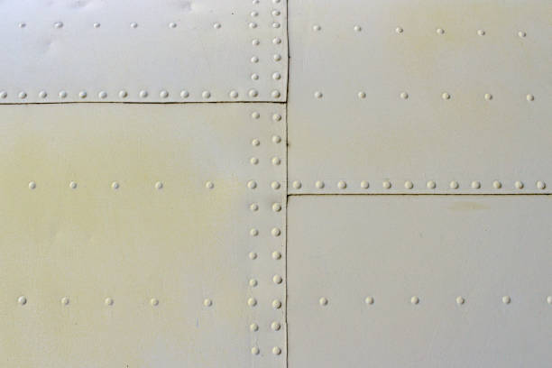 istock gray metal wall texture with seams and rivets 1140533812