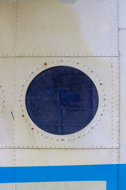 istock gray metal wall with a round porthole 1140533814