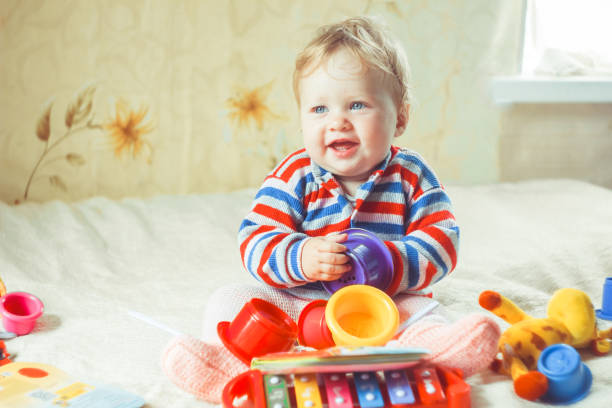 istock The child plays on the bed 1140533934