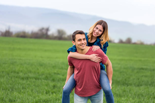 istock Couple walking in field and have fun 1140534141