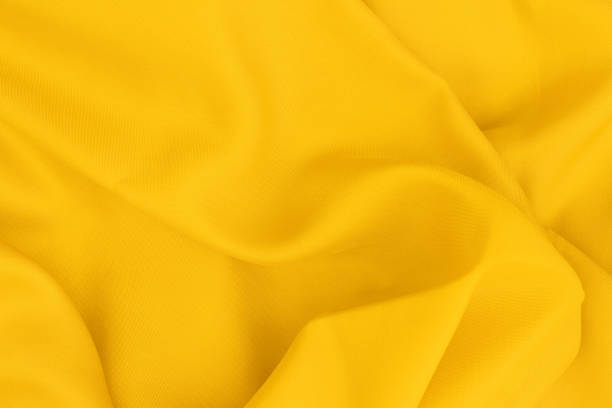 istock Yellow fabric texture for background and design art work, beautiful pattern of silk or linen. 1140535636