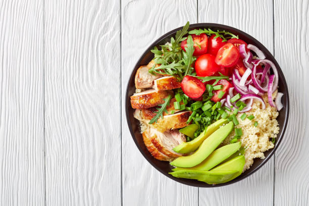 istock chicken bowl with couscous, greens and veggies 1140536425