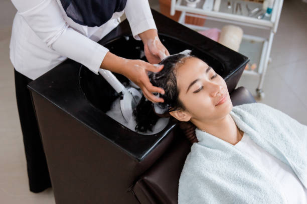 istock woman getting her hair washed 1140537250